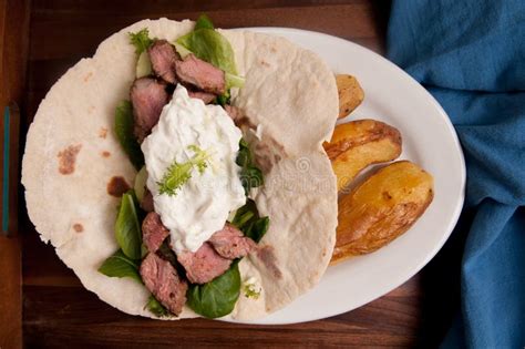 Grilled lamb souvlaki wrap stock photo. Image of kebab - 214187956