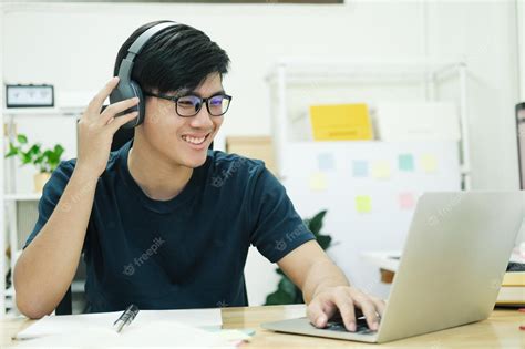 Premium Photo | Young man study in front of the laptop computer at home