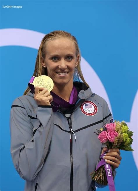 Dana Vollmer on the podium during the medal ceremony after setting a ...