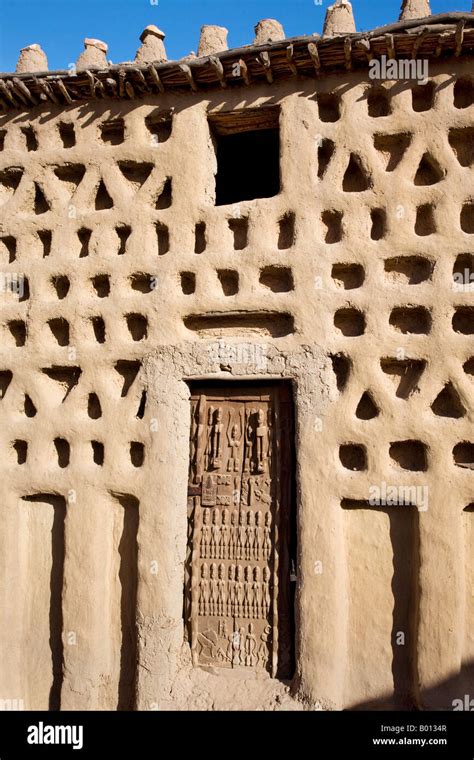 Mali, Dogon Country. A traditional Dogon house with a finely carved ...