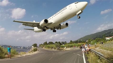 LOW flying BOEING and AIRBUS planes at SKIATHOS - Crossing the street ...