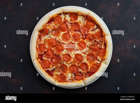 Top view of classic pepperoni pizza Stock Photo - Alamy