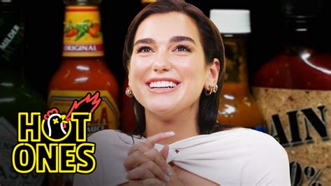 Dua Lipa Sweats From Her Eyes While Eating Spicy Wings | Complex