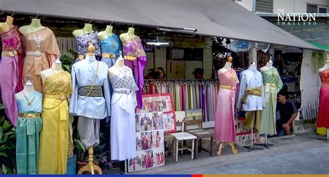 Tourist dressed in a traditional Thai costume visits Wat Arun temple in ...