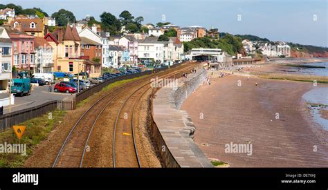 Dawlish Devon England with beach railway track and sea on blue sky ...