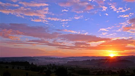 Photo of a Sunset Above the Clouds · Free Stock Photo