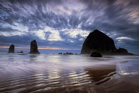 Haystack Rock At Sunset Photograph by Andrew Soundarajan