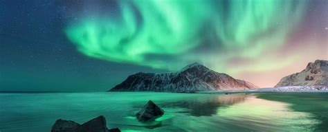 Aurora. Northern lights in Lofoten islands, Norway. Sky with pol ...