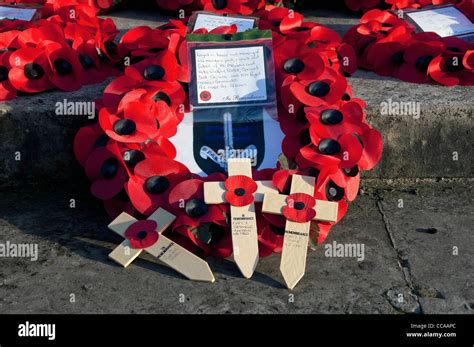 Close up of red poppy wreath wreaths and crosses on Remembrance Sunday ...