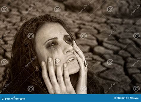 Sad Dirty Woman is at Cracked Earth Desert Stock Image - Image of ...