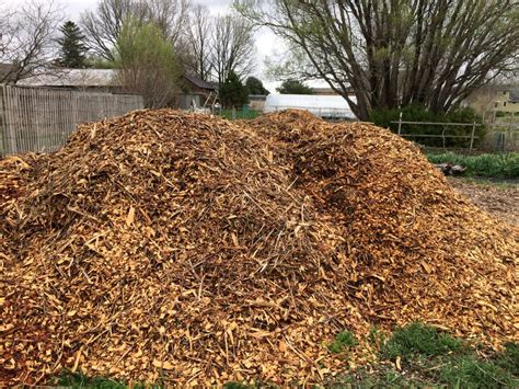 WHY WE USE WOOD CHIPS FOR MULCH - Heritage Flower Farm