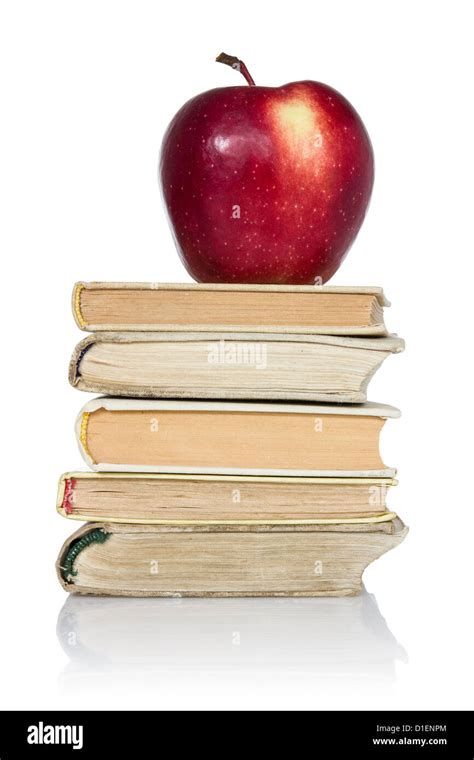 stack of books with apple on top over white background Stock Photo - Alamy