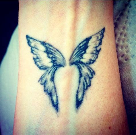 My beautiful wrist tattoo split between butterfly wings and angel wings ...