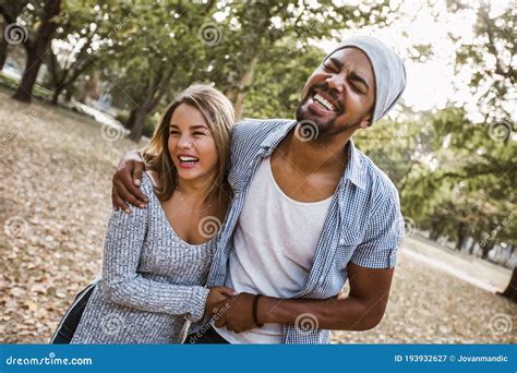 Portrait of Romantic and Happy Mixed Race Young Couple in Park Stock ...