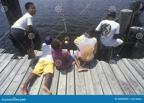 A Man And Two Children Fishing. Father And Two Sons Fishing, Trout At A ...