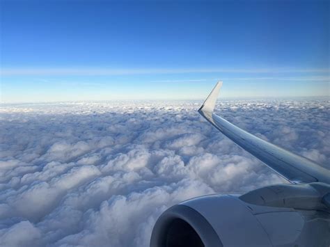 View from the airplane window. Beautiful cloudscape with blue sky ...