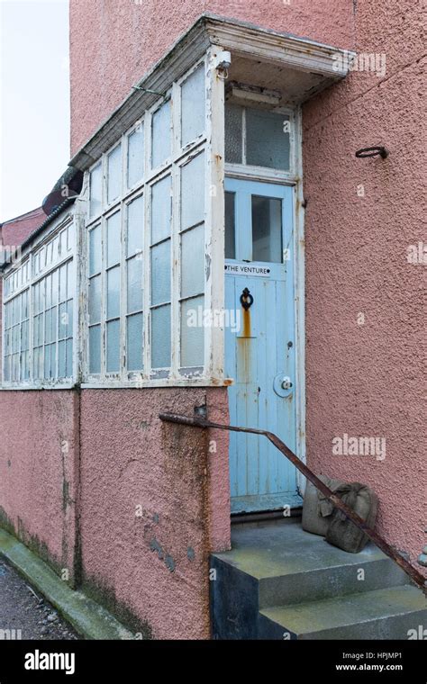 Weather worn wooden front door and porch in Torcross, Start Bay, devon ...