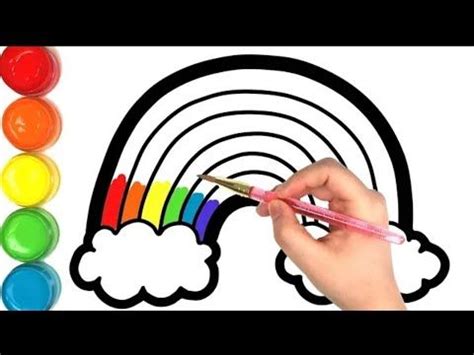 someone is drawing a rainbow with crayons