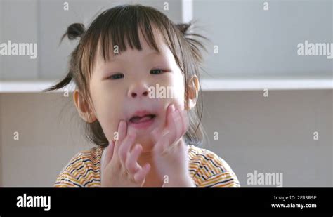 Little Girl Makes A Funny Face Stock Video Footage - Alamy