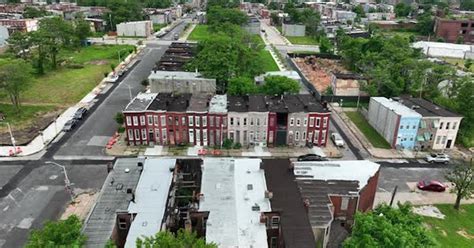 Urban city homes in unsafe neighborhood community. Boarded up houses in ...