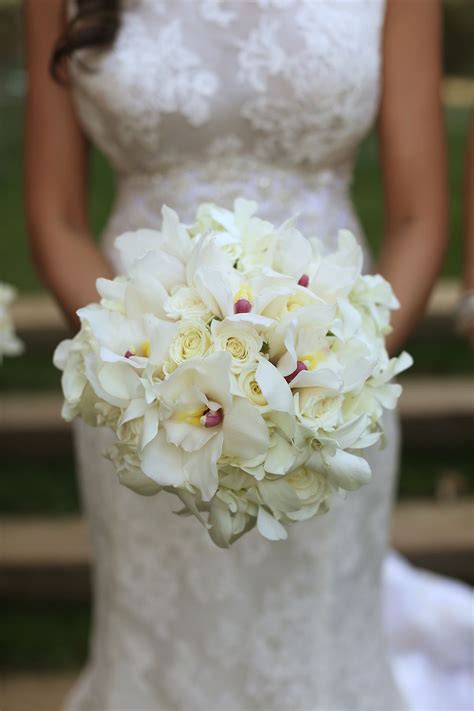 White orchid bouquet | Wedding bridal bouquets, Flower bouquet wedding ...