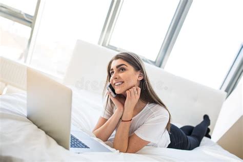 Woman Lying Down the Bed in Front of Her Laptop Stock Photo - Image of ...