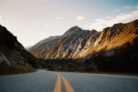 Landscape Photo of a Winding Road and a Mountain · Free Stock Photo