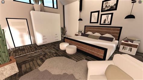 Modern Bedroom Design with Wood Flooring and White Furniture