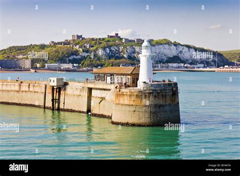 Dover Lighthouse with White Cliffs in Background Stock Photo - Alamy