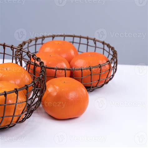 Fresh beautiful sliced sweet persimmon kaki isolated on white kitchen ...