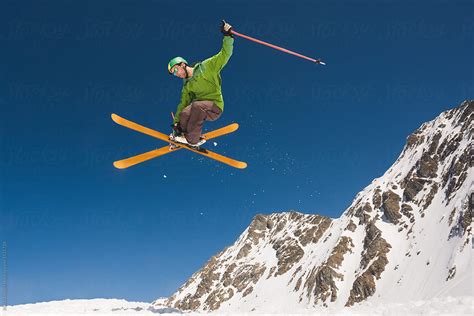 "Man Performing Skiing Helicopter Trick Against The Blue Sky" by ...