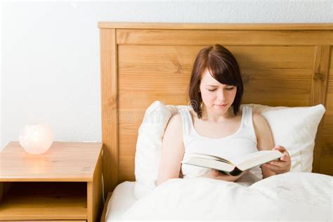 Reading In Bed Stock Photos - Image: 9352023