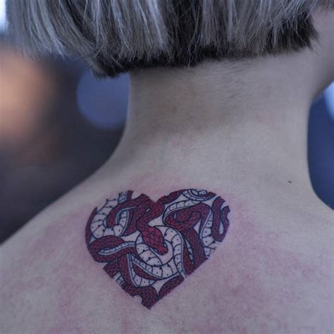 Heart shaped snakes tattoo - Tattoogrid.net