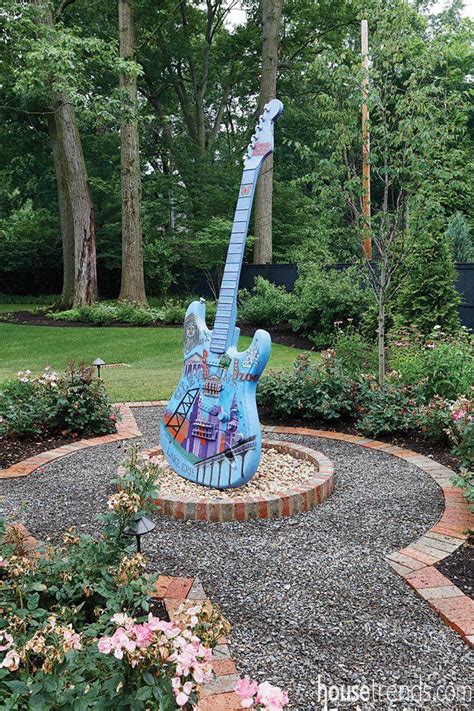 Guitar adds whimsy to a formal garden | Formal garden, Whimsy, Art of ...