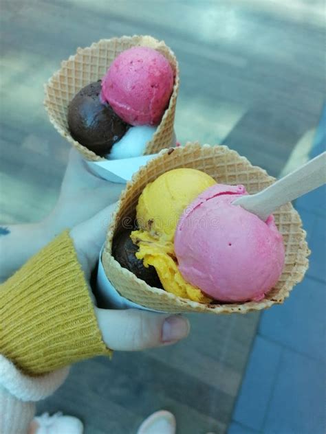 A Scoop of Ice Cream in a Cone Stock Photo - Image of petal, pink ...