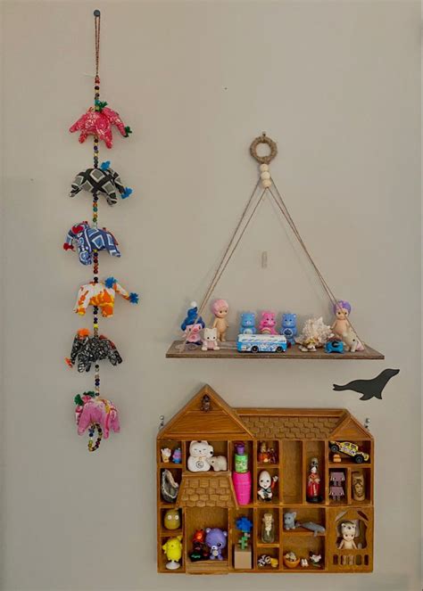 there are many toys hanging on the wall