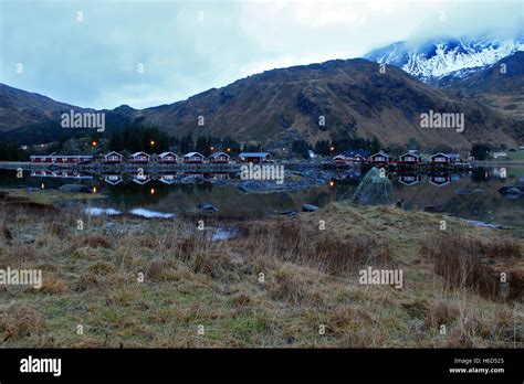 Lofoten Islands - Camping cabins reflected in a lake Stock Photo - Alamy