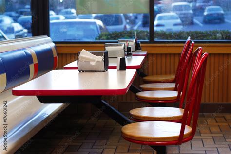 Table and seats inside fast food restaurant Stock Photo | Adobe Stock