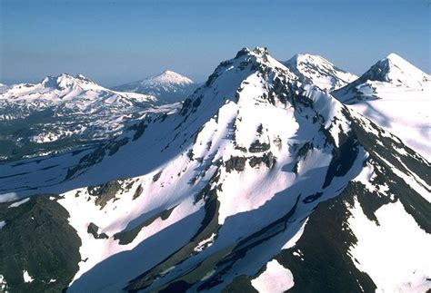 On the right side of this photo are the Three Sisters Volcanoes, three ...