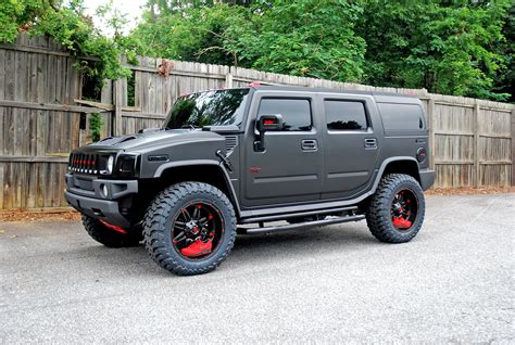 Hummer H2 wrapped with a satin black wrap outfitted on some 22" Fuel ...