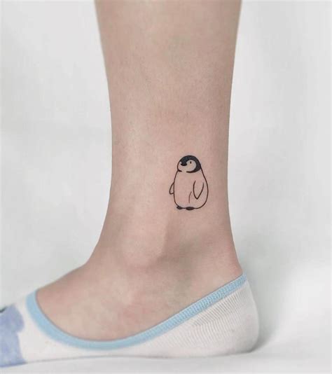 pictures of penguin tattoos - rosetattooswithribbons