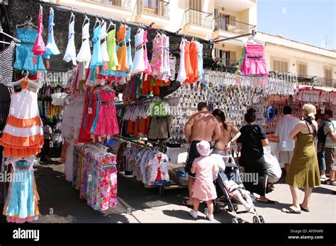 Tourists shopping at the traditional market at the old town of Stock ...