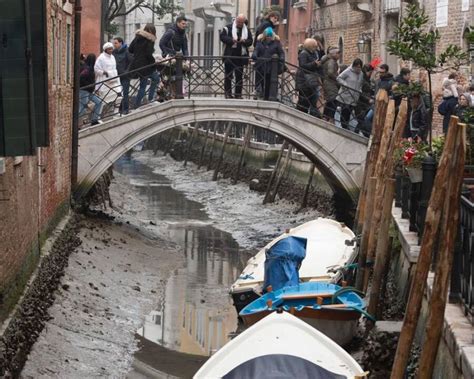 Drought And Low Tides Cause Venetian Canals To Run Dry