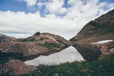 "Alpine Lake In The Mountains" by Stocksy Contributor "Carl Zoch" - Stocksy