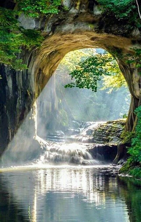 there is a waterfall in the middle of a river with water coming out of it