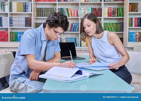 College Students Guy and Girl Study in Library Stock Image - Image of ...