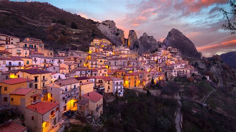 Sunset in Lucan Dolomites over Castelmezzano village, Potenza ...