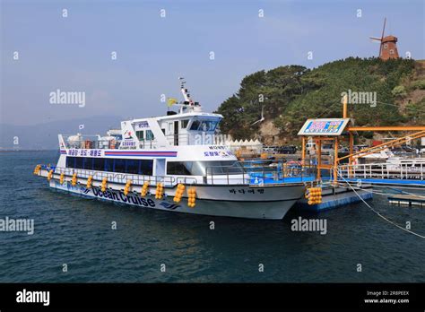 GEOJE, SOUTH KOREA - APRIL 1, 2023: Ocean cruise ship and winmill on ...