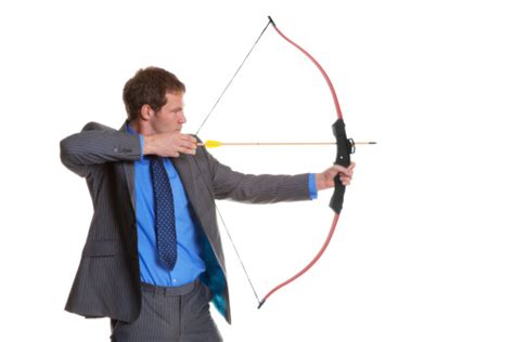 Businessman Shooting A Bow And Arrow Stock Photo - Download Image Now ...