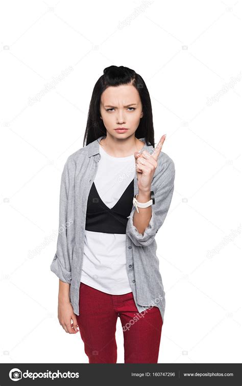 Serious girl pointing with finger — Stock Photo © IgorVetushko #160747296